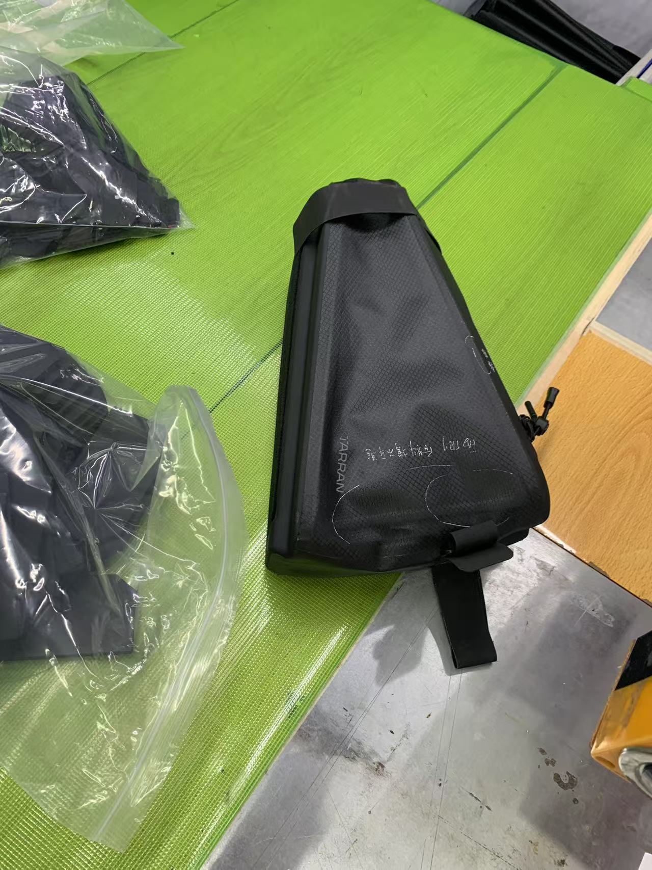 Finished bikepacking frame bag showing welded seams and hook-and-loop mounting tabs